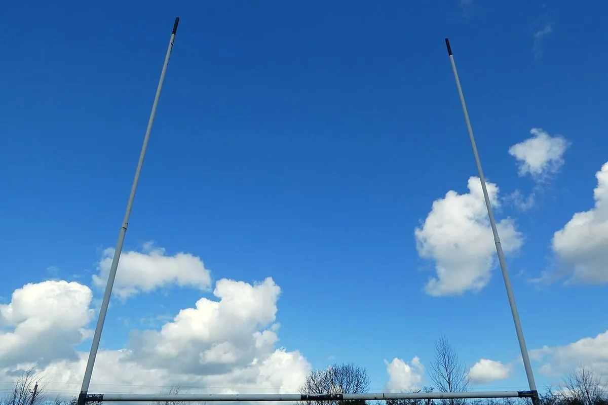 Gaelic football goalposts against a blue sky